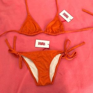 Solid and striped bikini bathing suit set.